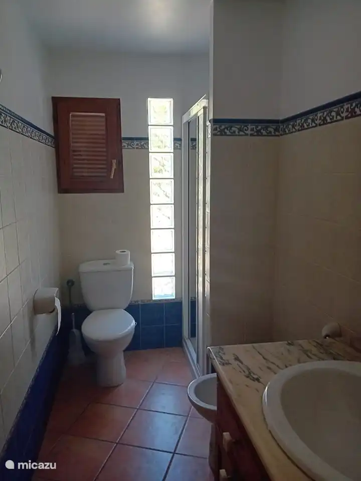 Bathroom, with bidet, toilet, sink and shower. Simple but good.