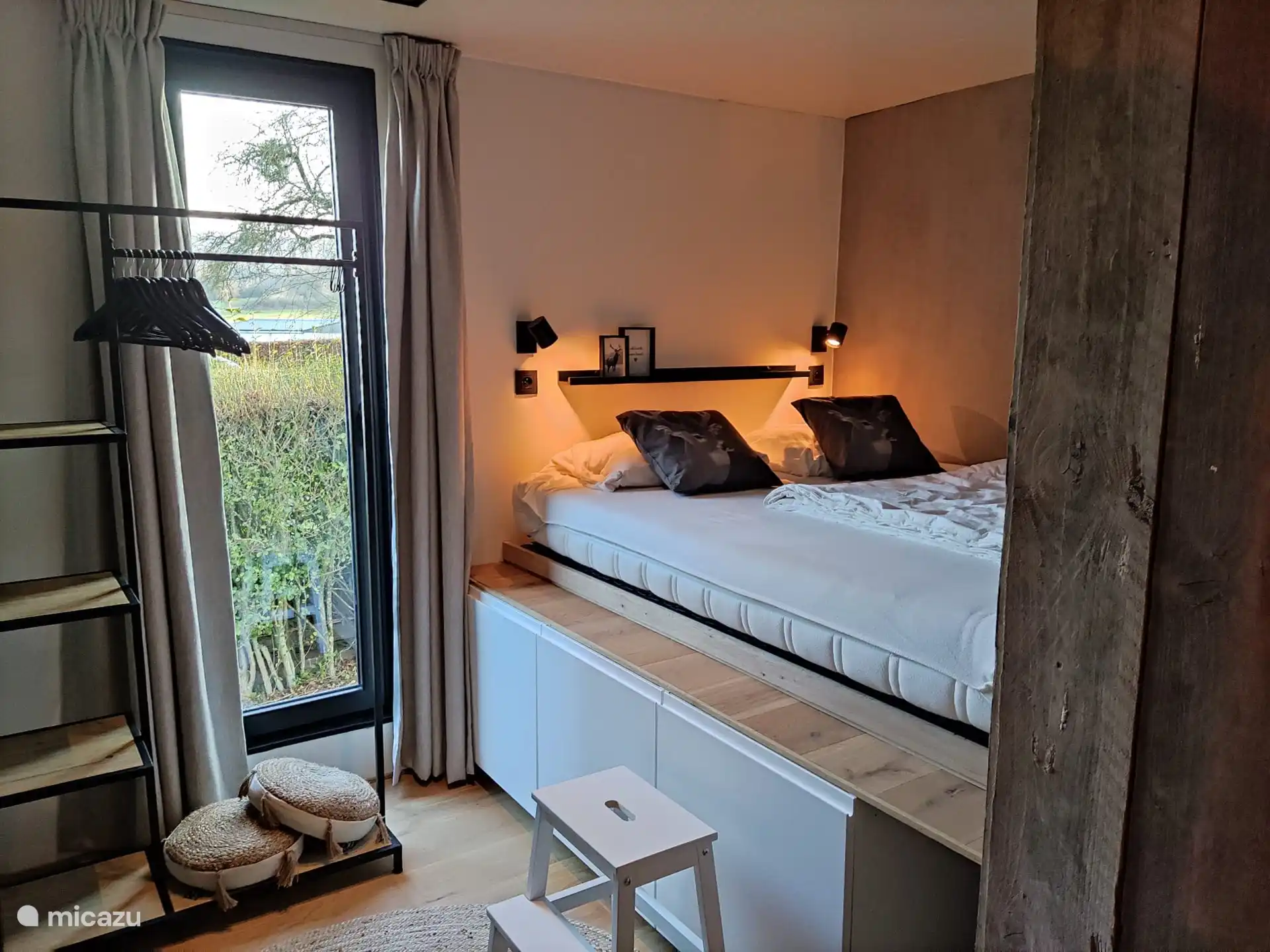 storage space under the large bed and clothes rack with coat racks for coats and more... bed 220 x 160