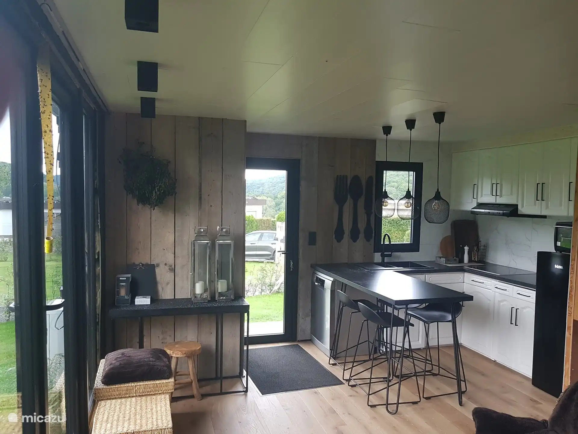 kitchen corner, with the cloakroom for walking shoes and coats on the left upon entering