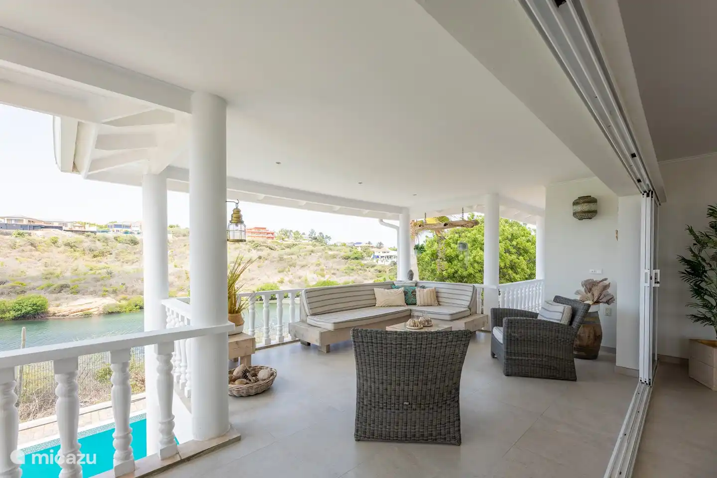 Top floor: Porche/veranda with views of Spanish Water, Caribbean Sea, Caracas Bay and swimming pool.