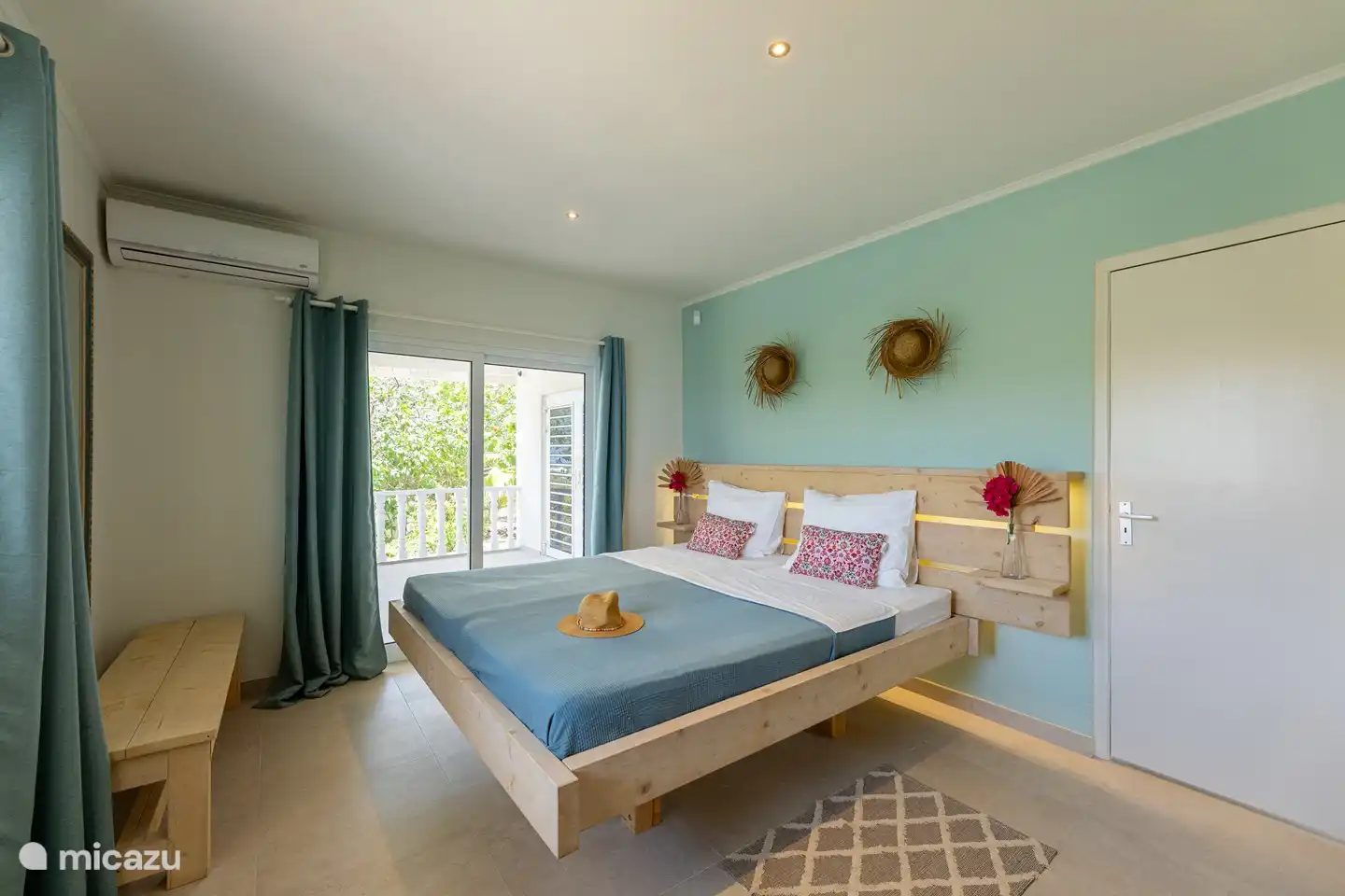 Upper floor: Bedroom 1 with sliding doors to the rear porch/veranda.