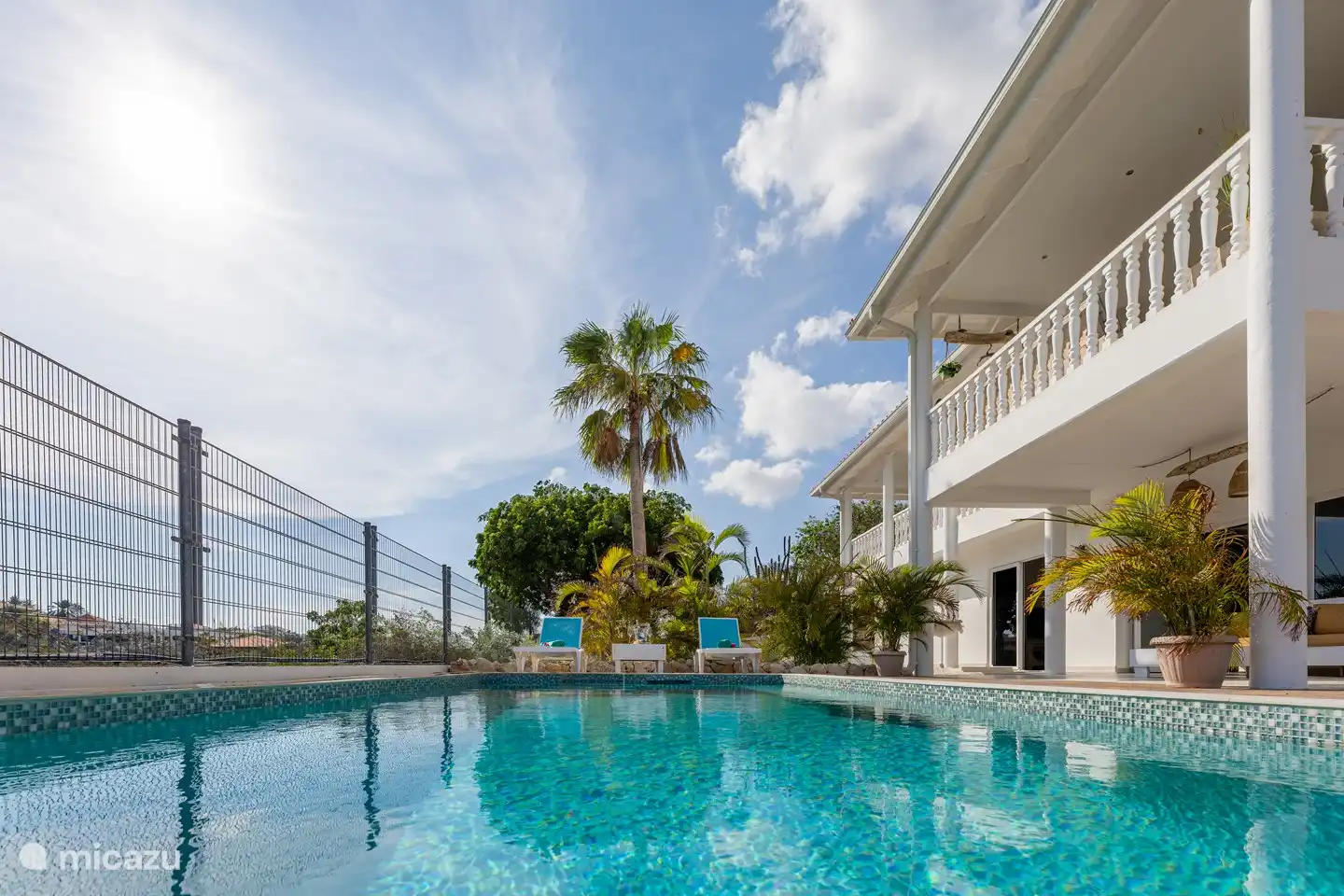 Ground floor: Swimming pool with a lounge/sofa.