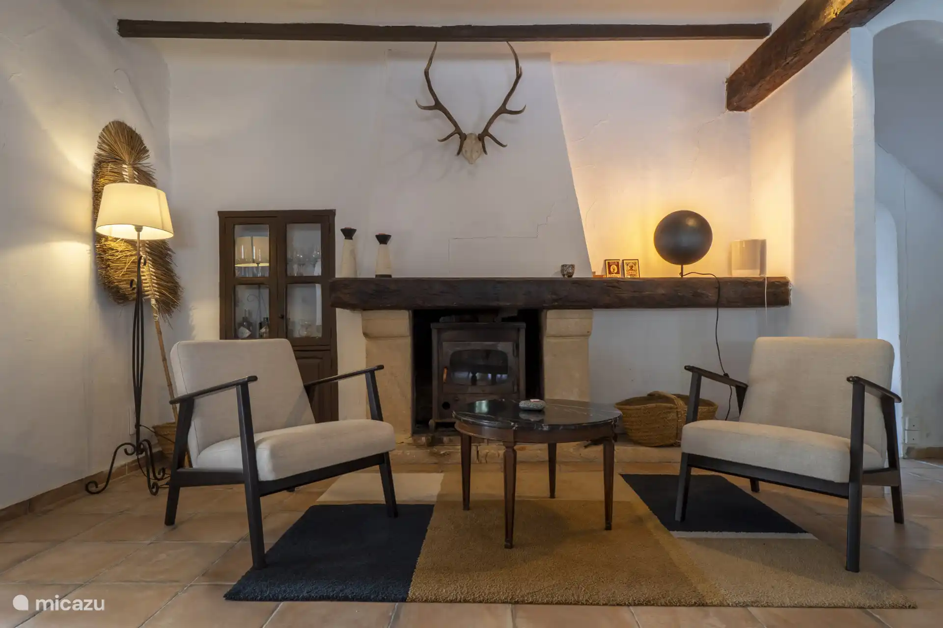 The second living room has a wood stove.