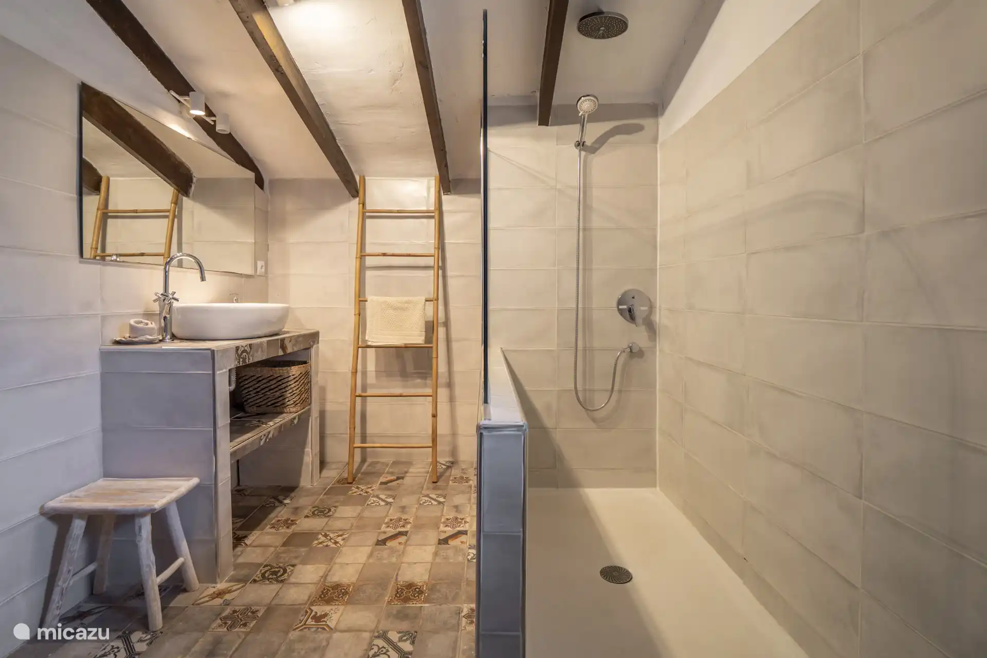 On the upper floor is the third and last bathroom and it has a shower, sink and toilet.