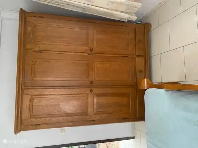 oak wardrobe in large room