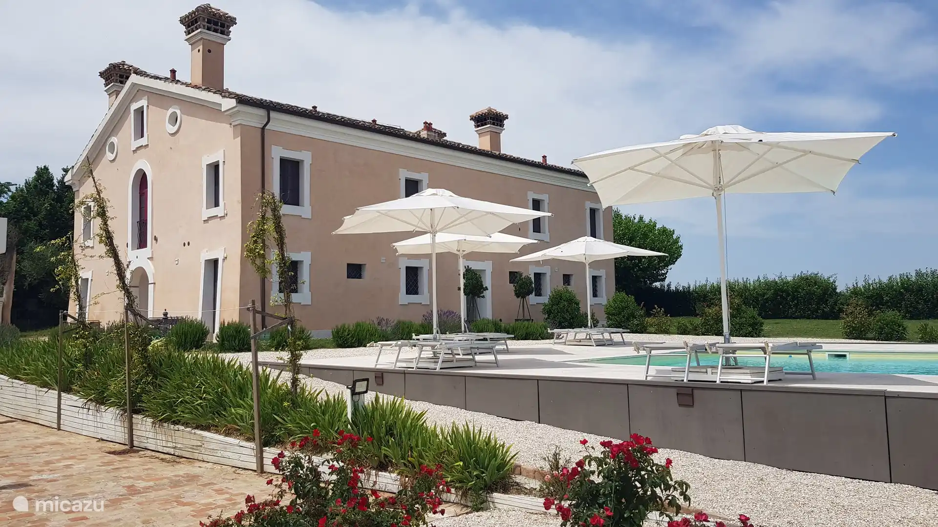 Villa Montefiore and the lovely swimming pool with plenty of sun beds and umbrellas