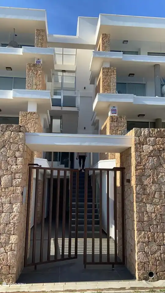 The stairs to the apartment, you walk past the other apartments in the first row.
