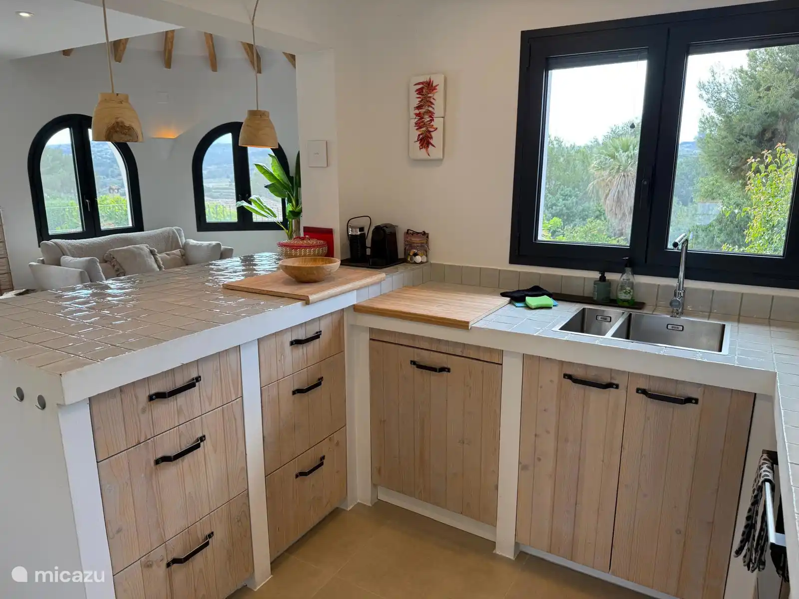 The modern kitchen is adjacent to the living room