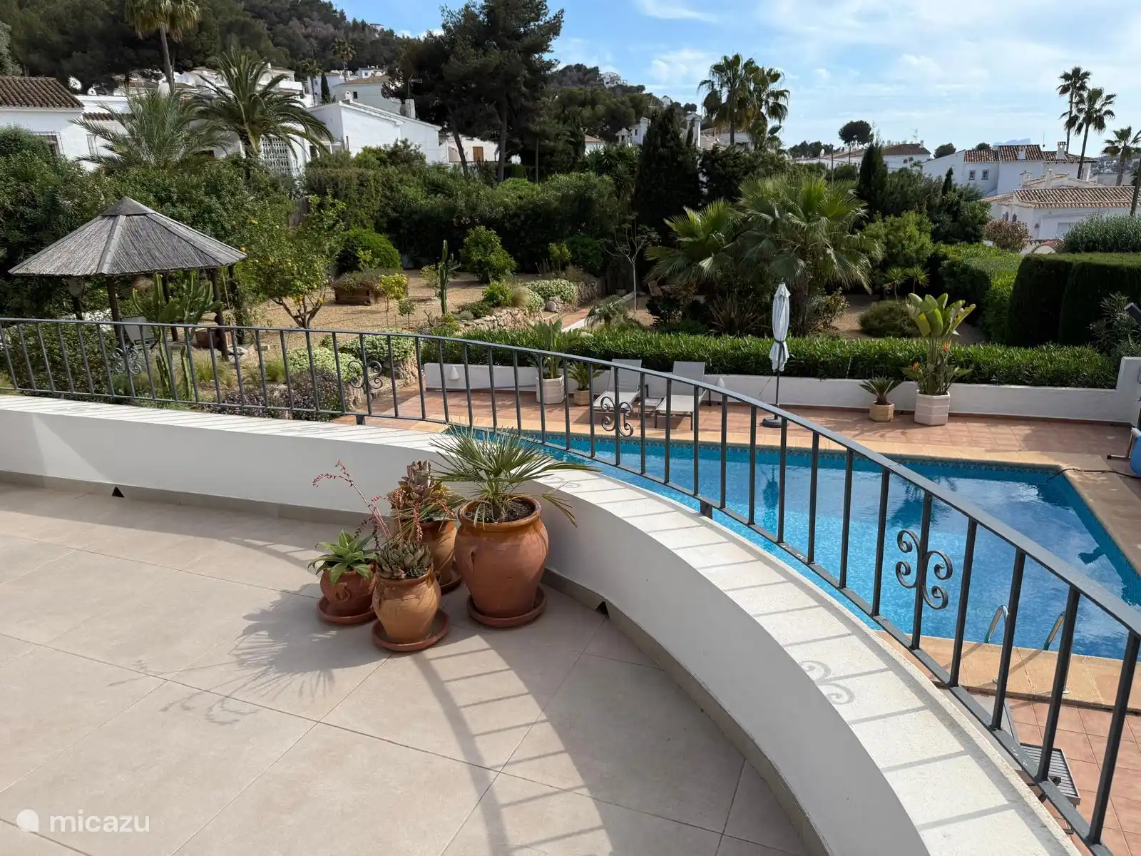 From the balcony at the main house you have a beautiful view of the garden and the swimming pool