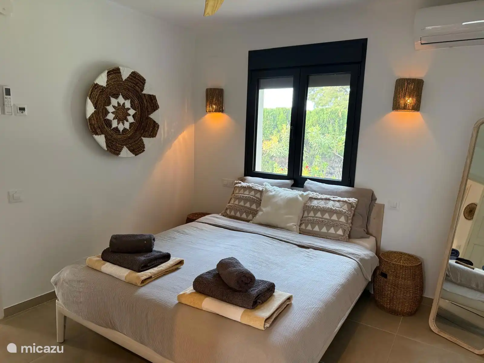 the master bedroom, equipped with air conditioning and fan with ensuite bathroom