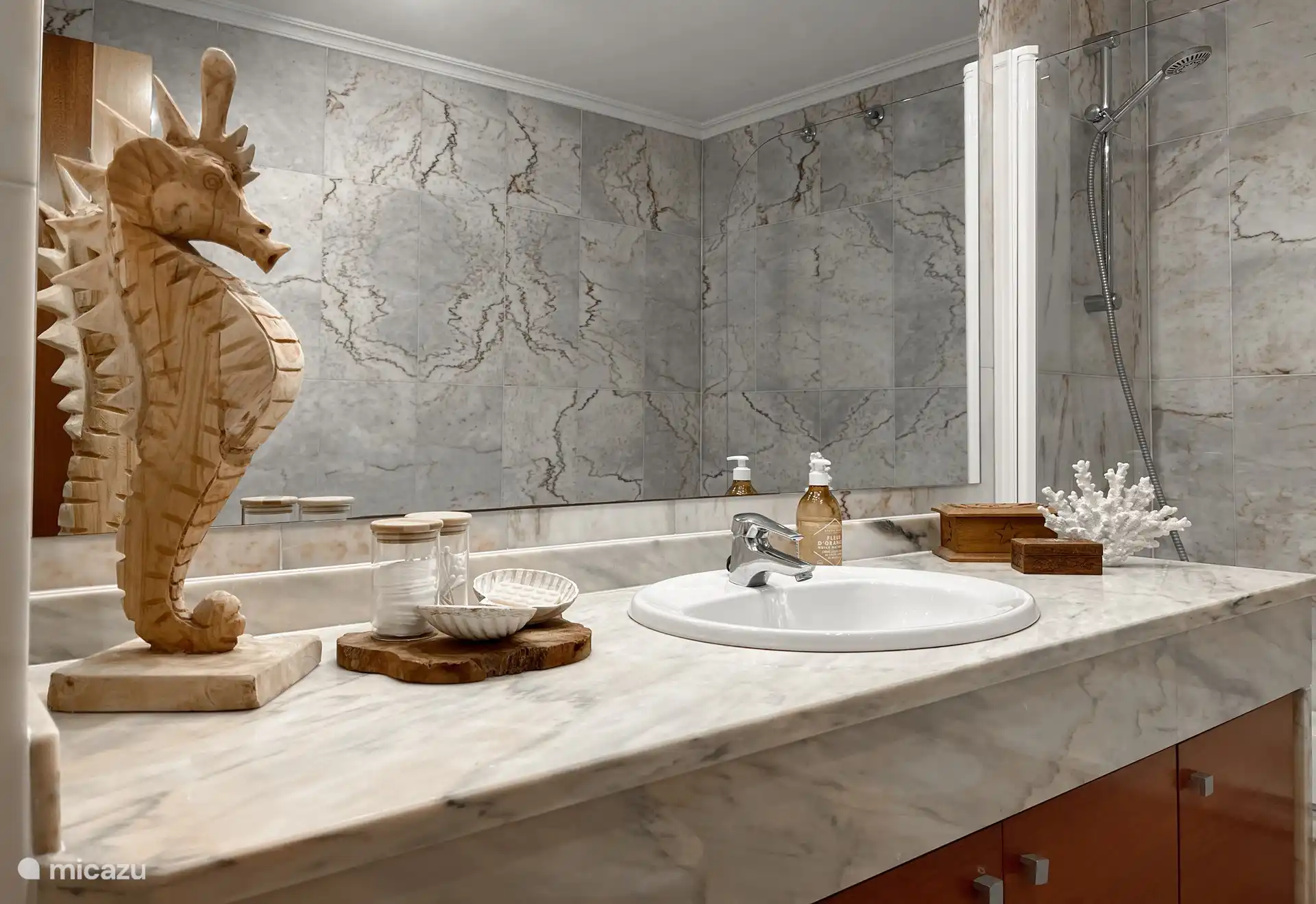 Nice big mirror, hair dryer, hand soap.