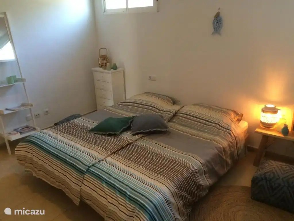 Bedroom 2 with 2 single beds and 1 bunk bed.