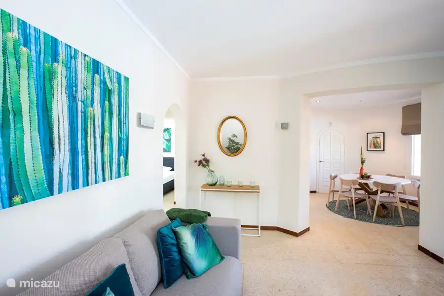 Living room with a view of the dining area.
