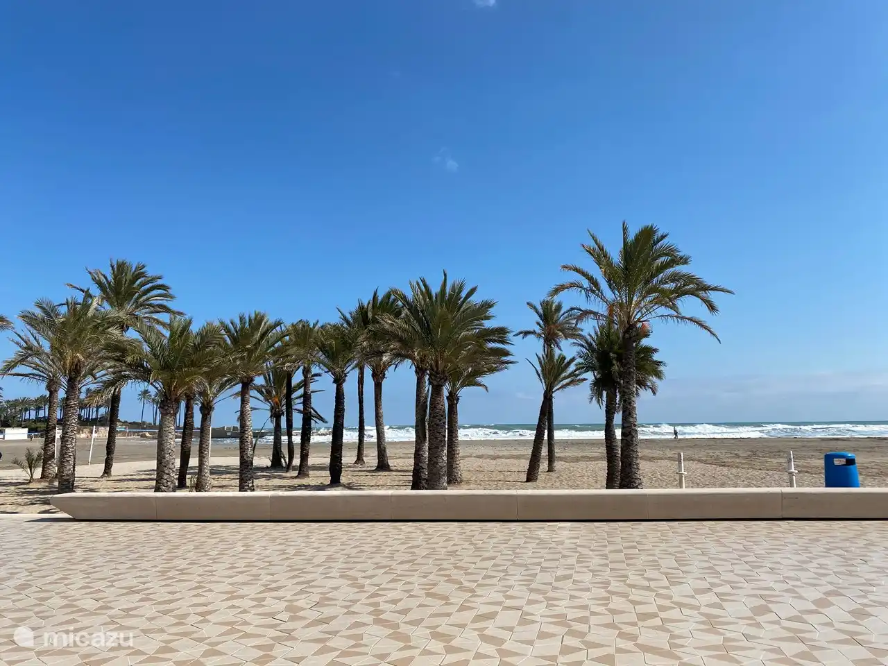 Playa del Arenal beach with the boulevard and its many delicious restaurants and nice shops