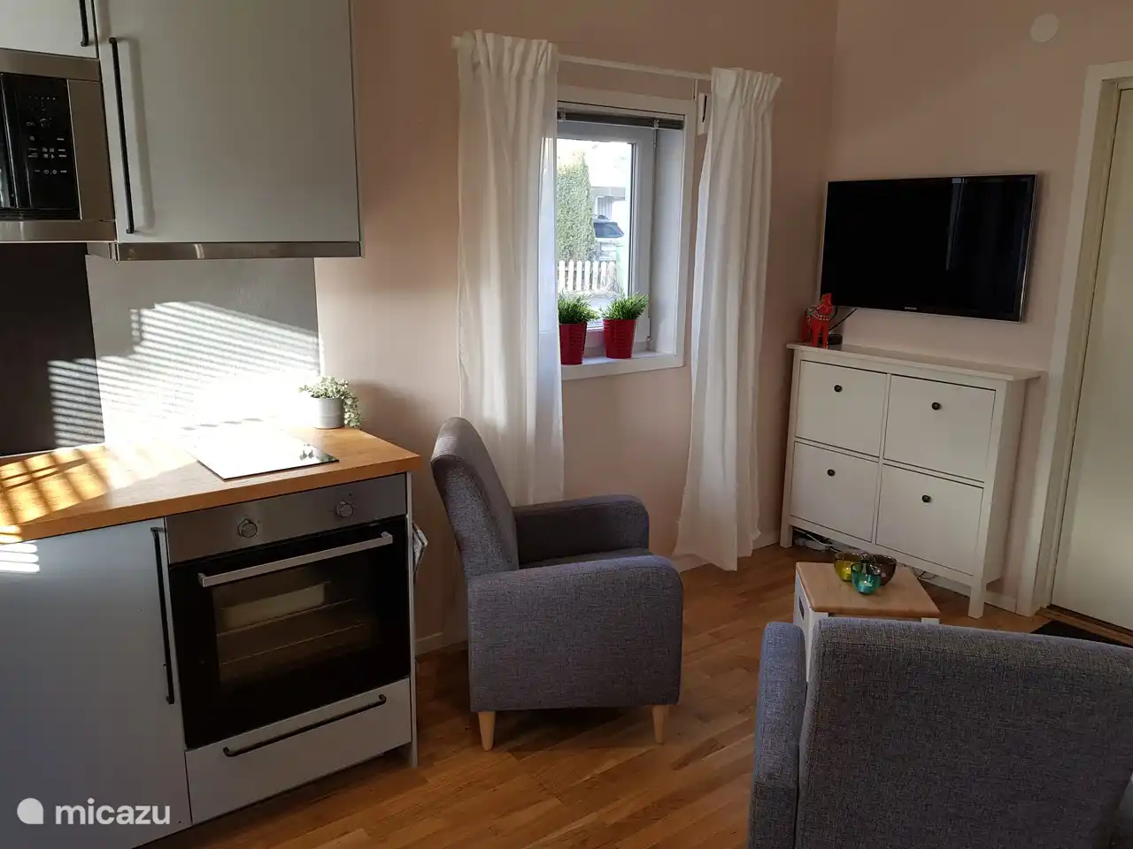 The living room with smart TV and Apple TV.