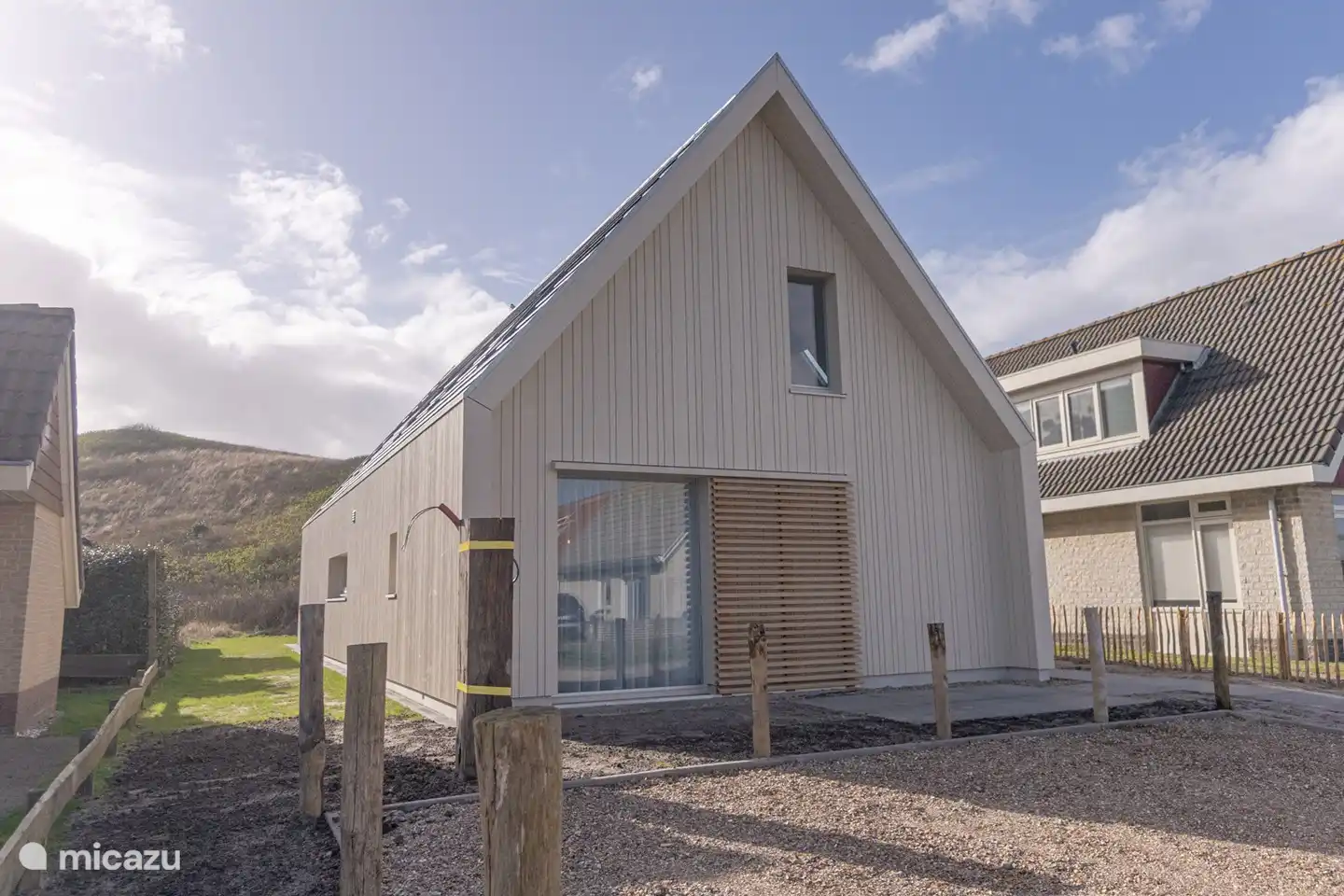 Front of the house, with charging station for electric car