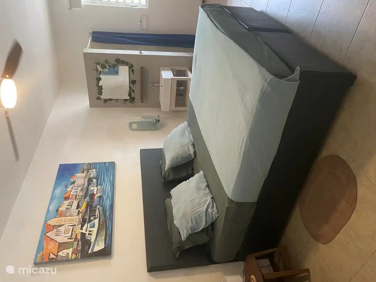 The master bedroom has a king-size bed with a private shower and sink