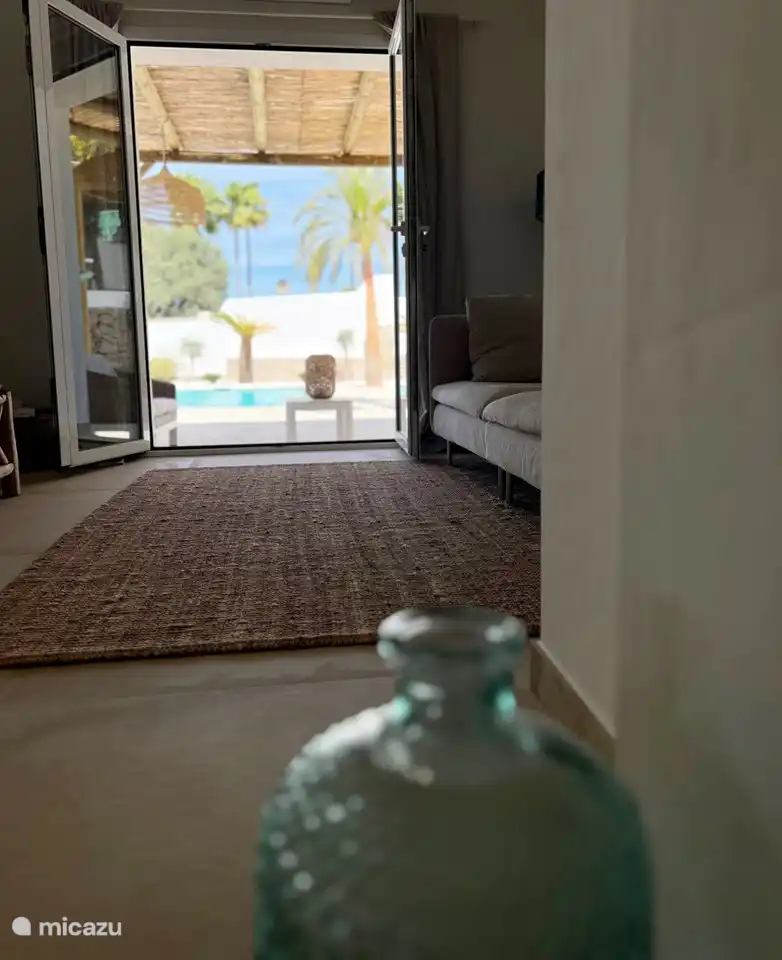 The swimming pool is on the same floor as the living room, master bedroom and kitchen.