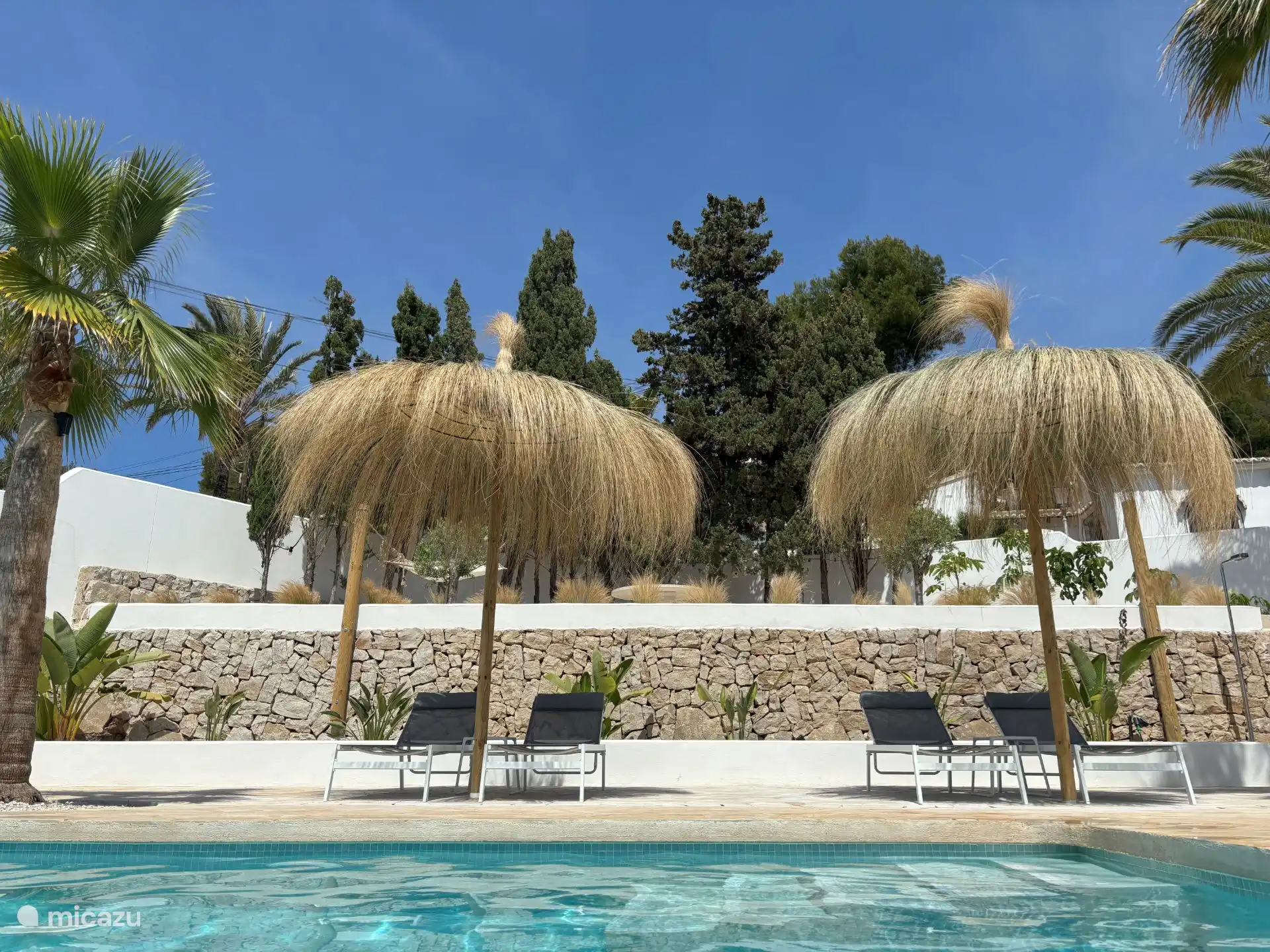 Can you see yourself lying there? Reading a book in the shade of the camouflage cloth at the edge of your own swimming pool...