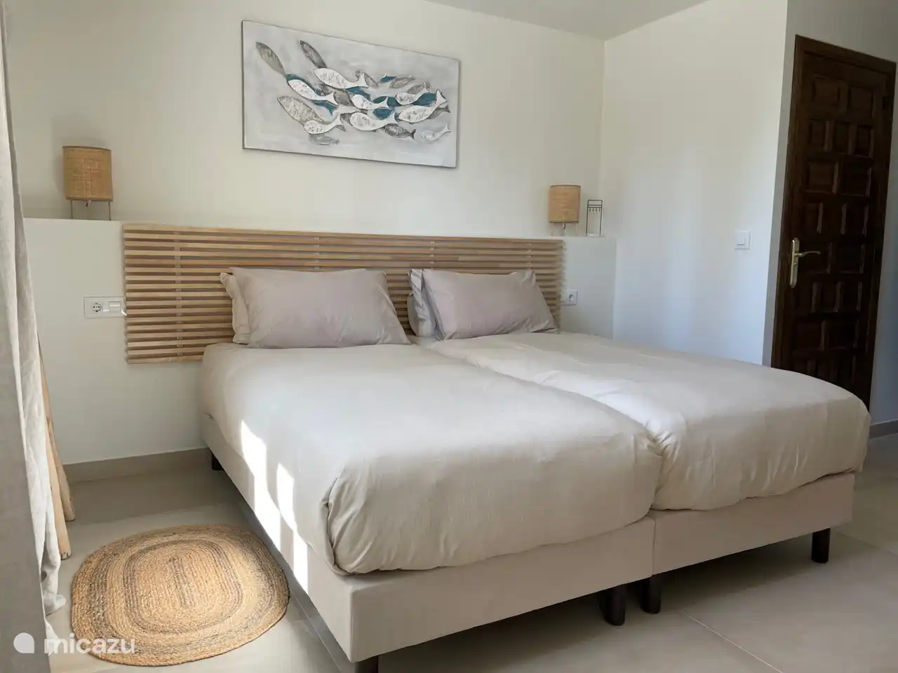 The other bedroom downstairs has two lovely single box-spring beds