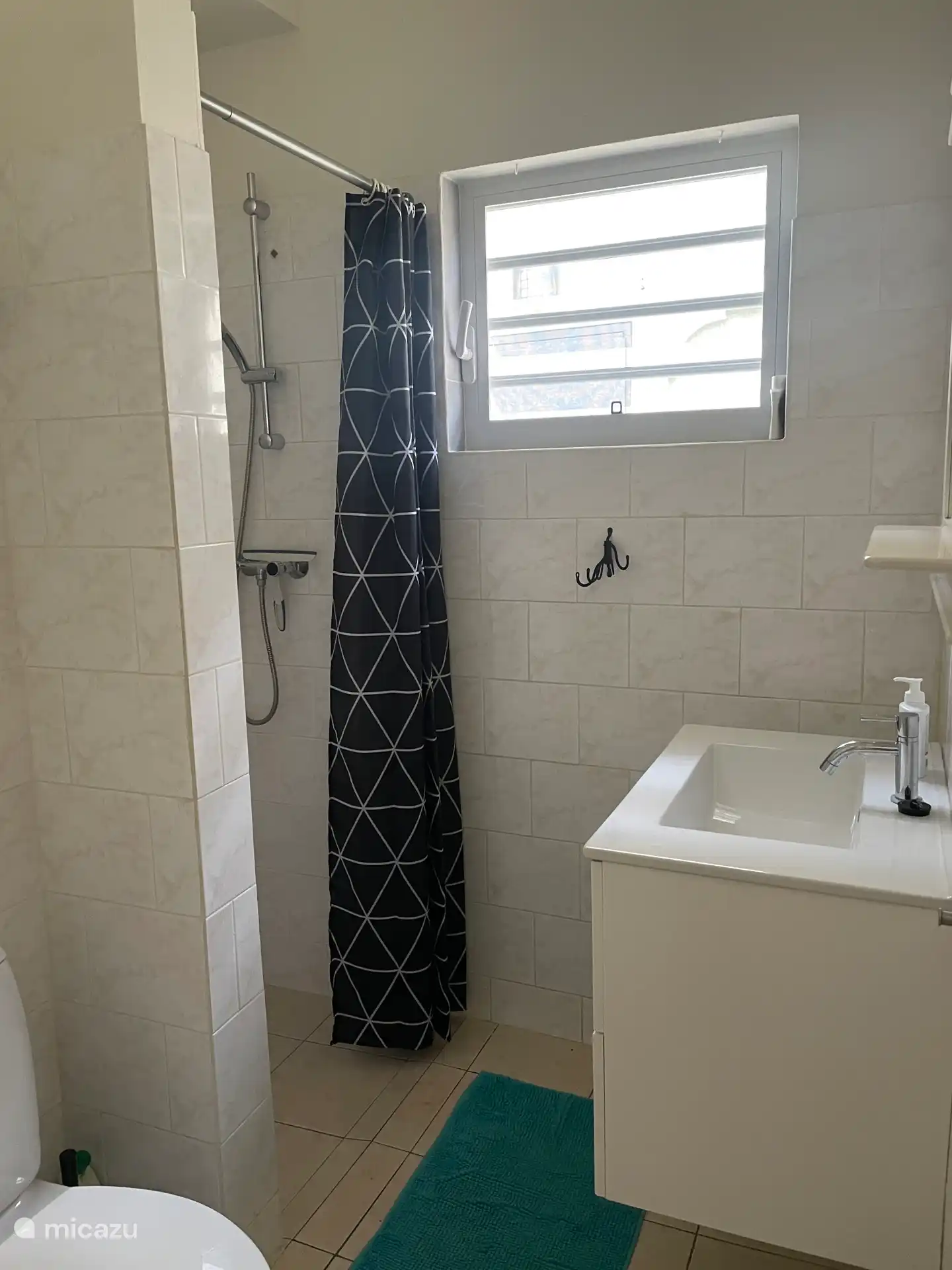 Bathroom with shower, sink and toilet