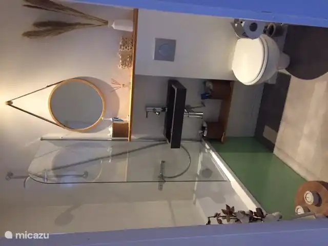 Bathroom with bath, shower and toilet, extraction system for moisture and odors. Window that opens.
hair dryer available.