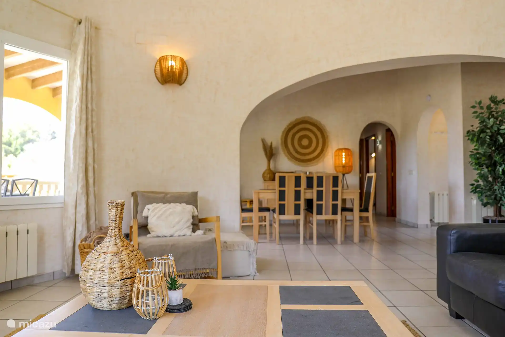 The cozy living room with dining table