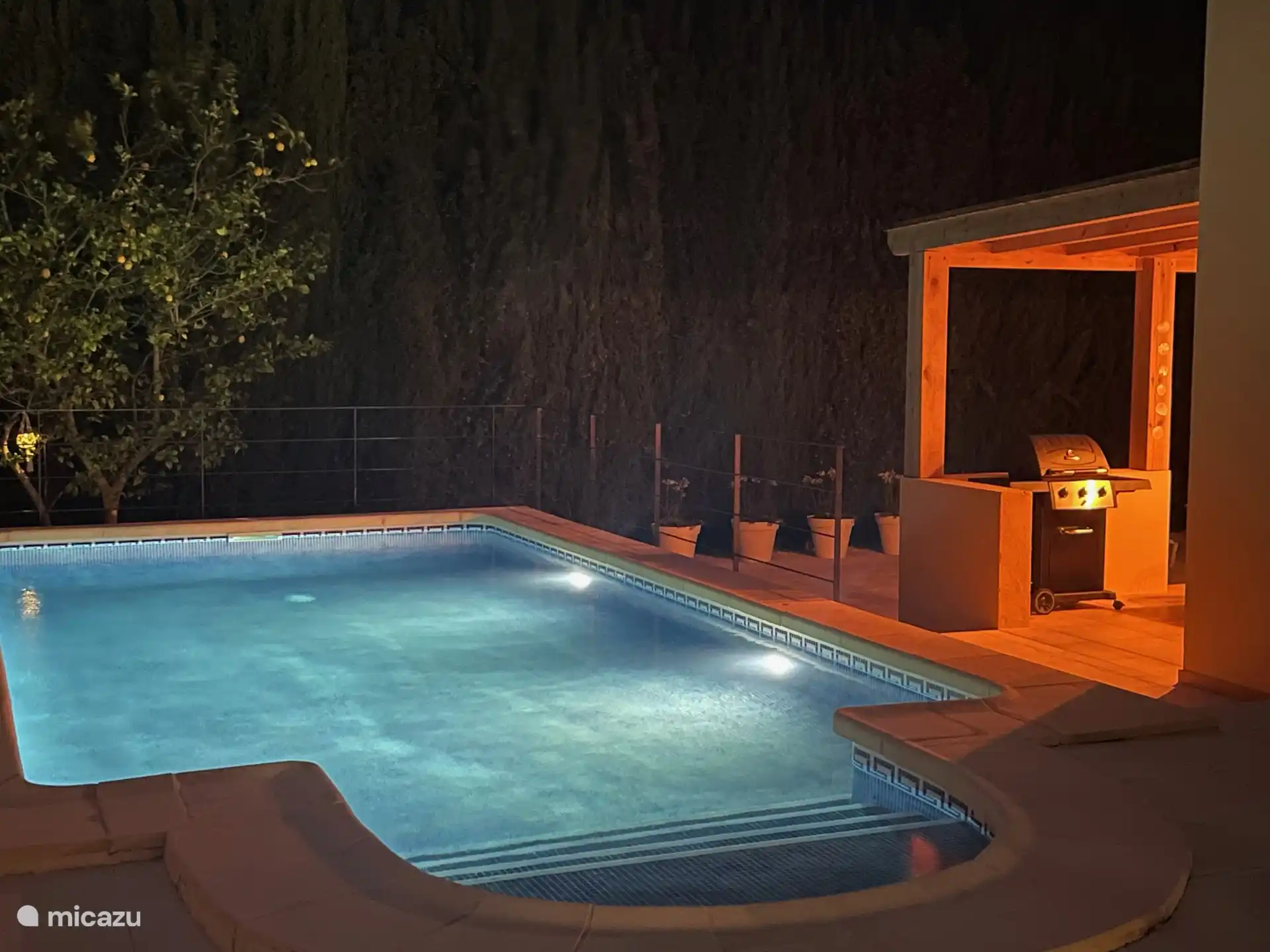 Private pool is lit in the evening