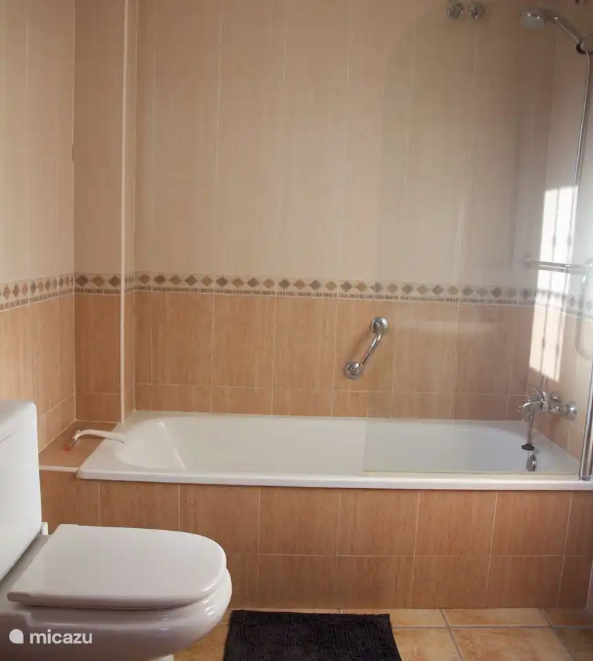 The bathroom adjacent to the master bedroom