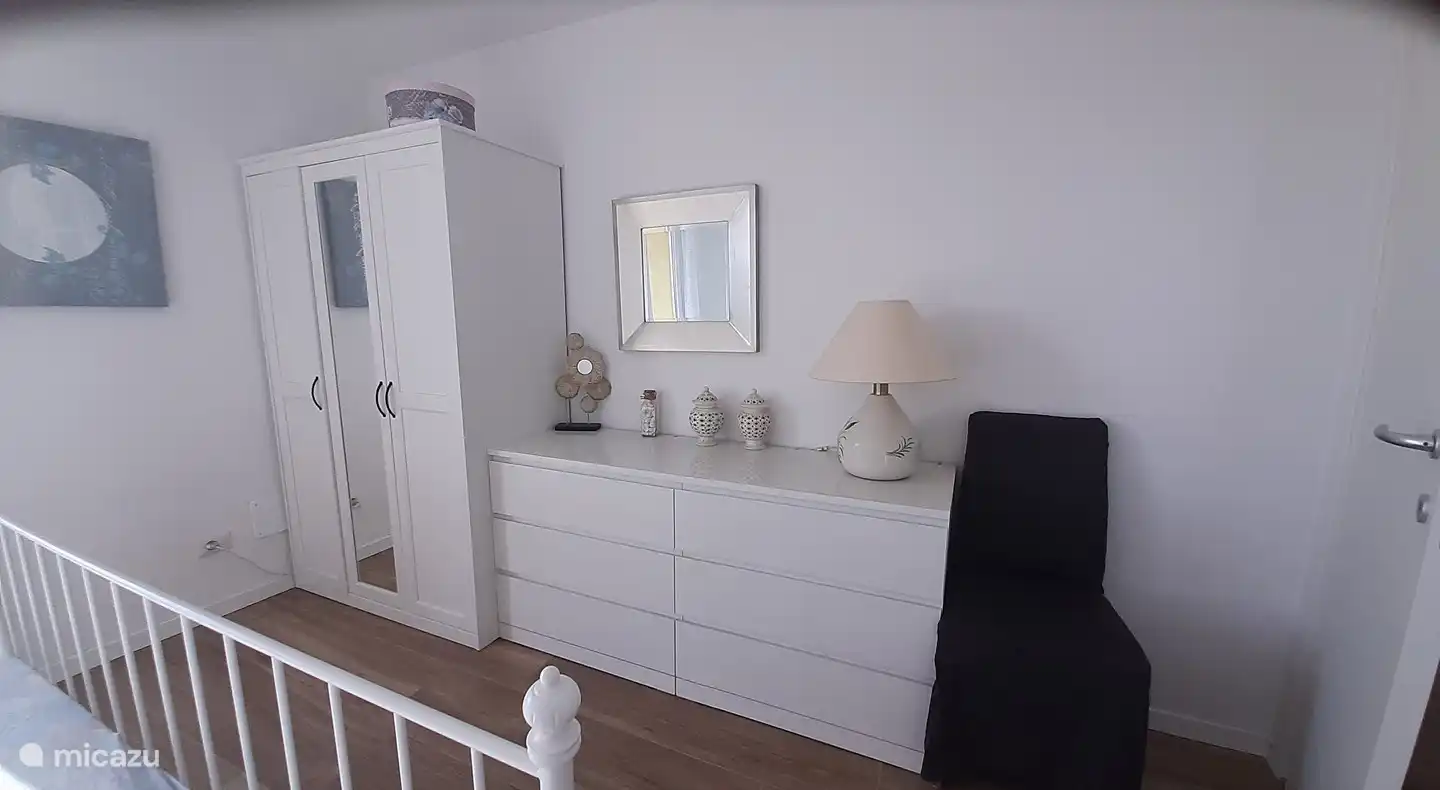 2 person bedroom with nice spacious closet and a dresser with a mirror above it