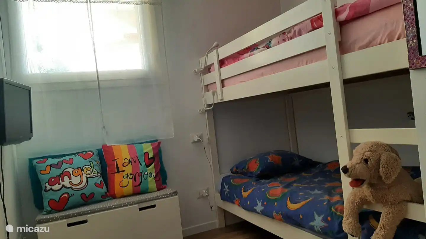 The children's room is nicely furnished with bunk beds 90x200 and a wardrobe.