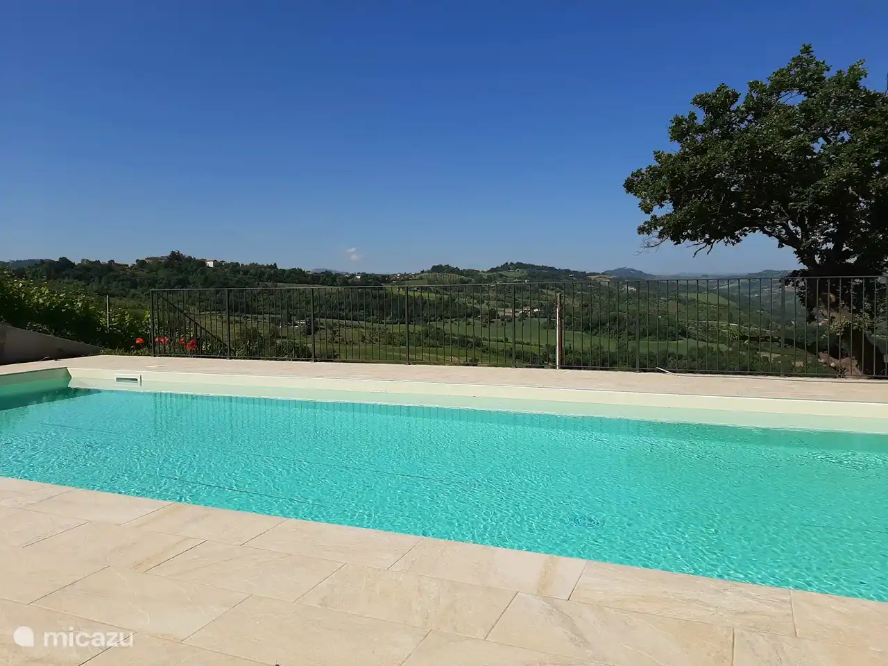 Here you can see the view from the sunbathing area and the swimming pool