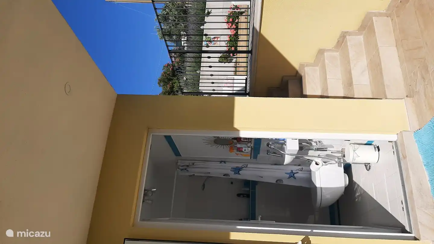 This is the bathroom of the pool with toilet and shower