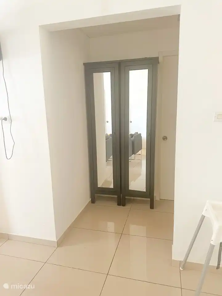 Hallway to bathroom and twin beds room.