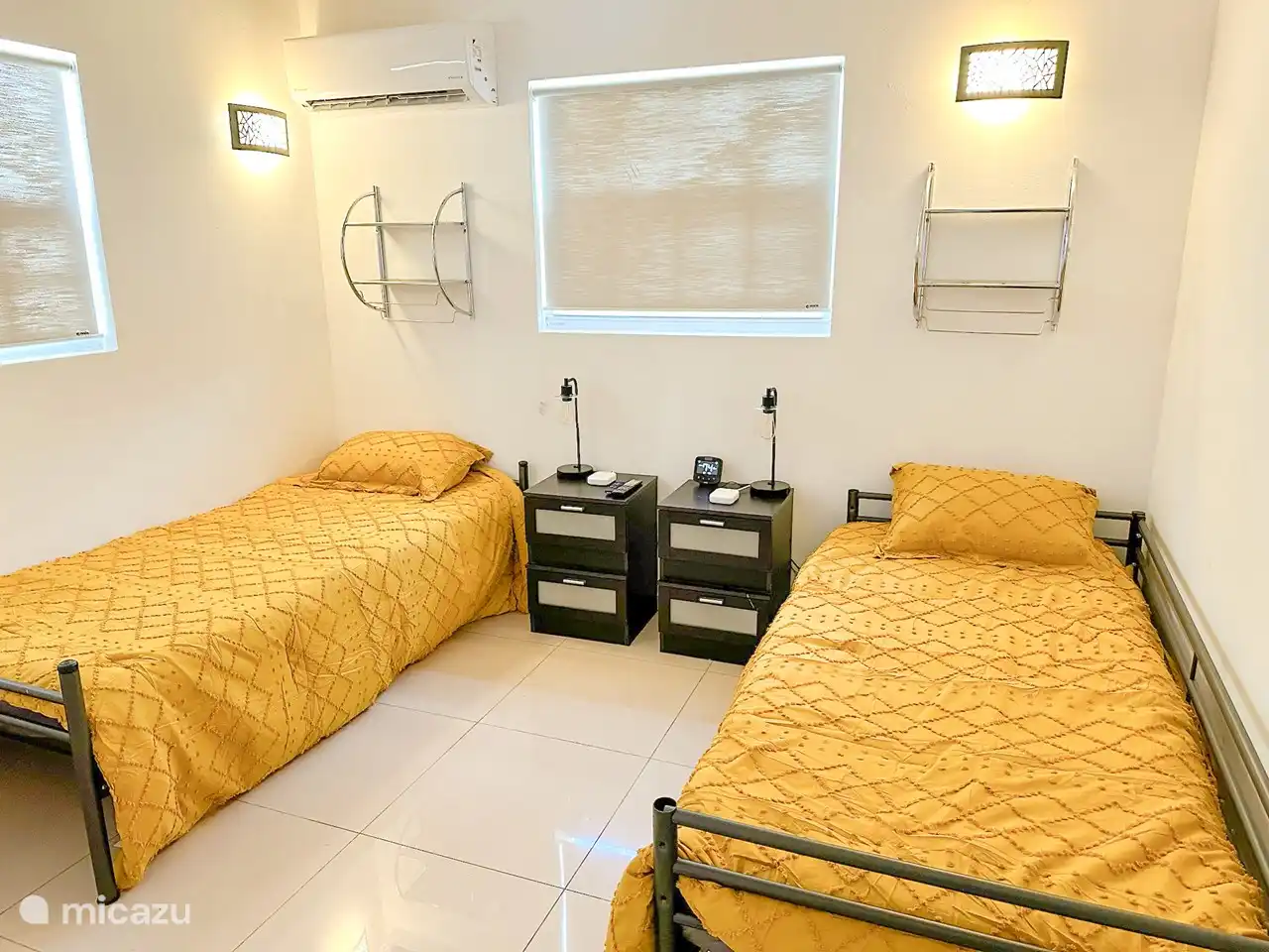 Bedroom 2. Two twin beds, side tables with power station, lamps, wardrobe, AC, digital AC thermostat.