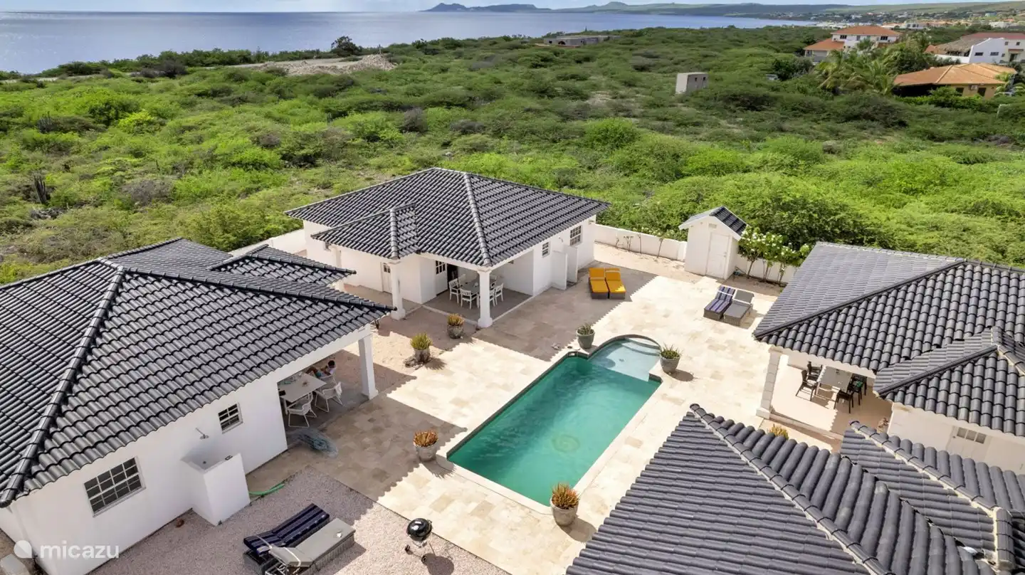 Four villas surrounding a shared pool make this villa feel like a resort.