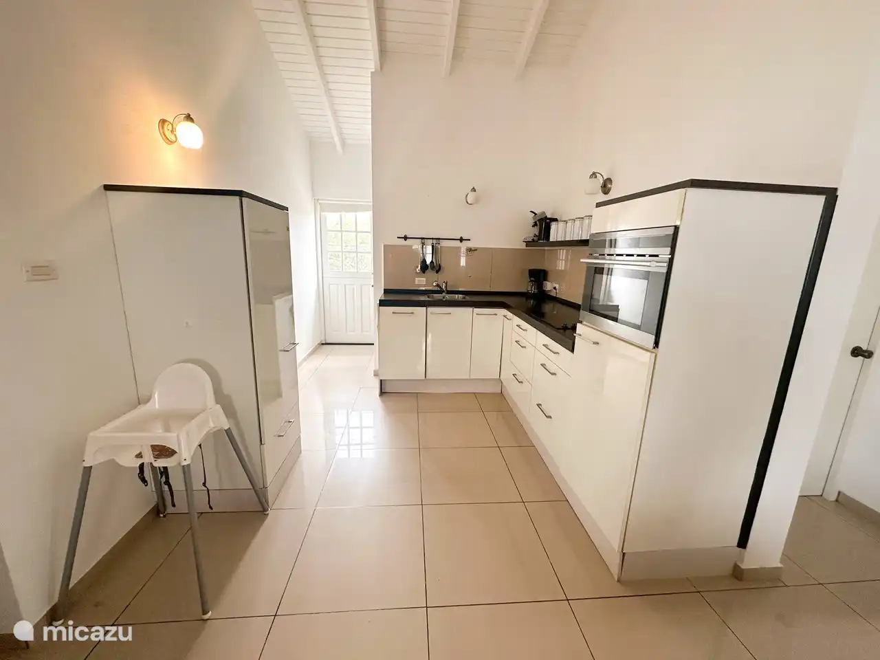 Kitchen with freezer and fridge, dishwasher.