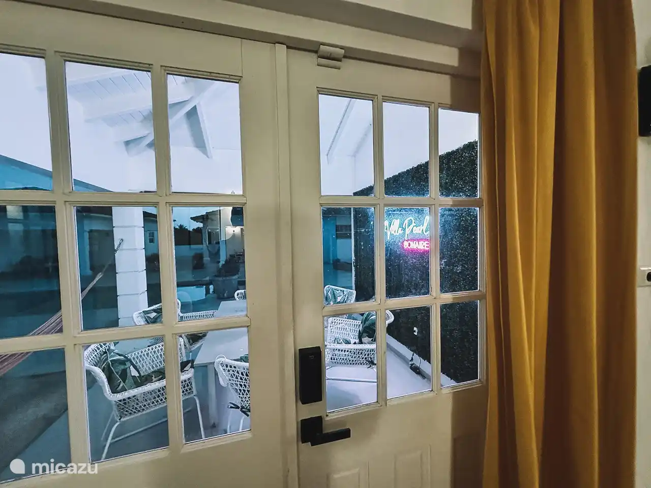 Looking out the doors to the patio from the living room.