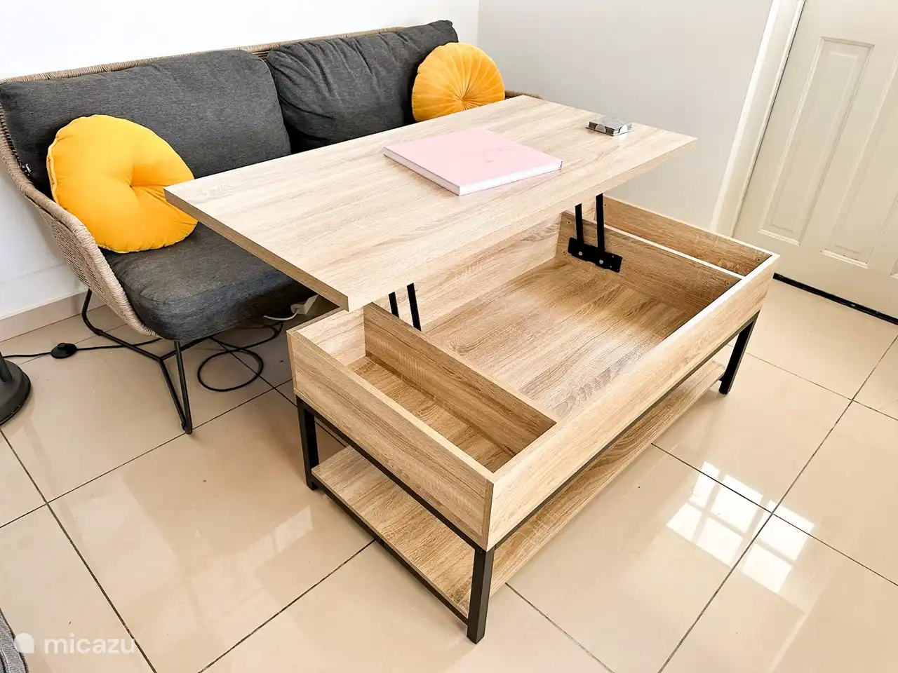 Since there is no indoor dining room or office, we thought a nice amenity would be to have a lift top coffee table. Can be used to eat in the living room or to work remotely.