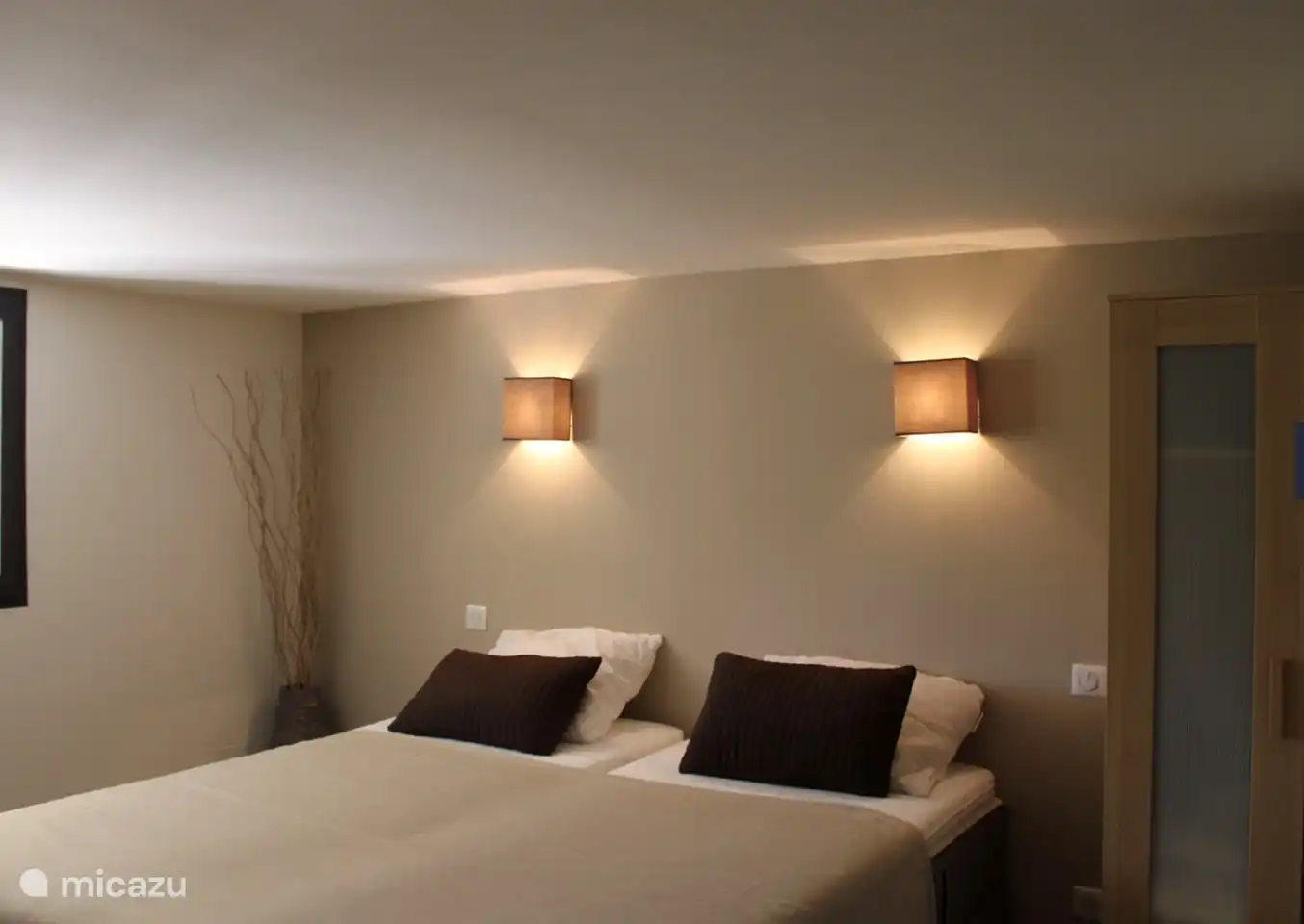 downstairs bedroom with two single beds that can be pushed apart