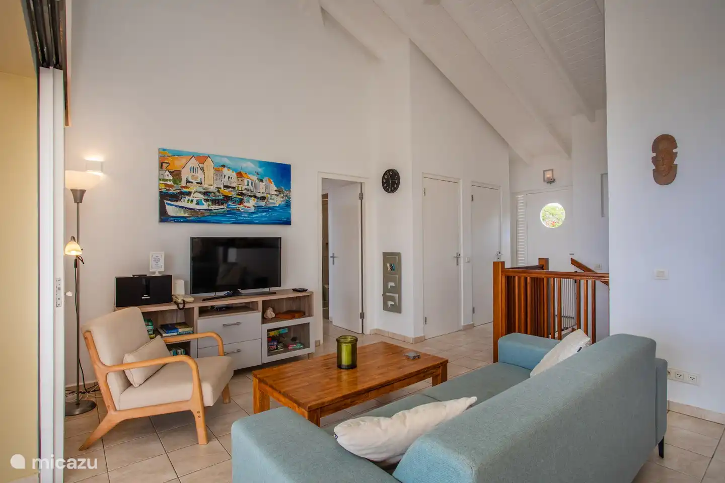 Living room, left door in the middle goes to MBR. Middle door is space of the washing machine.