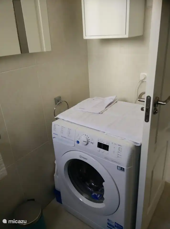 Washing machine in bathroom upstairs 