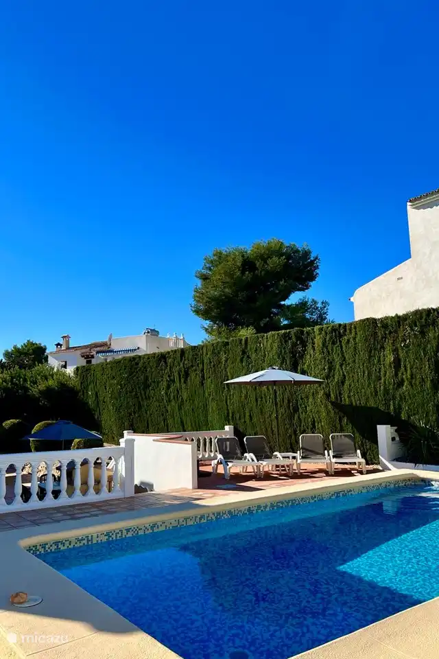 There are several sunbeds around the private swimming pool of Villa Lara