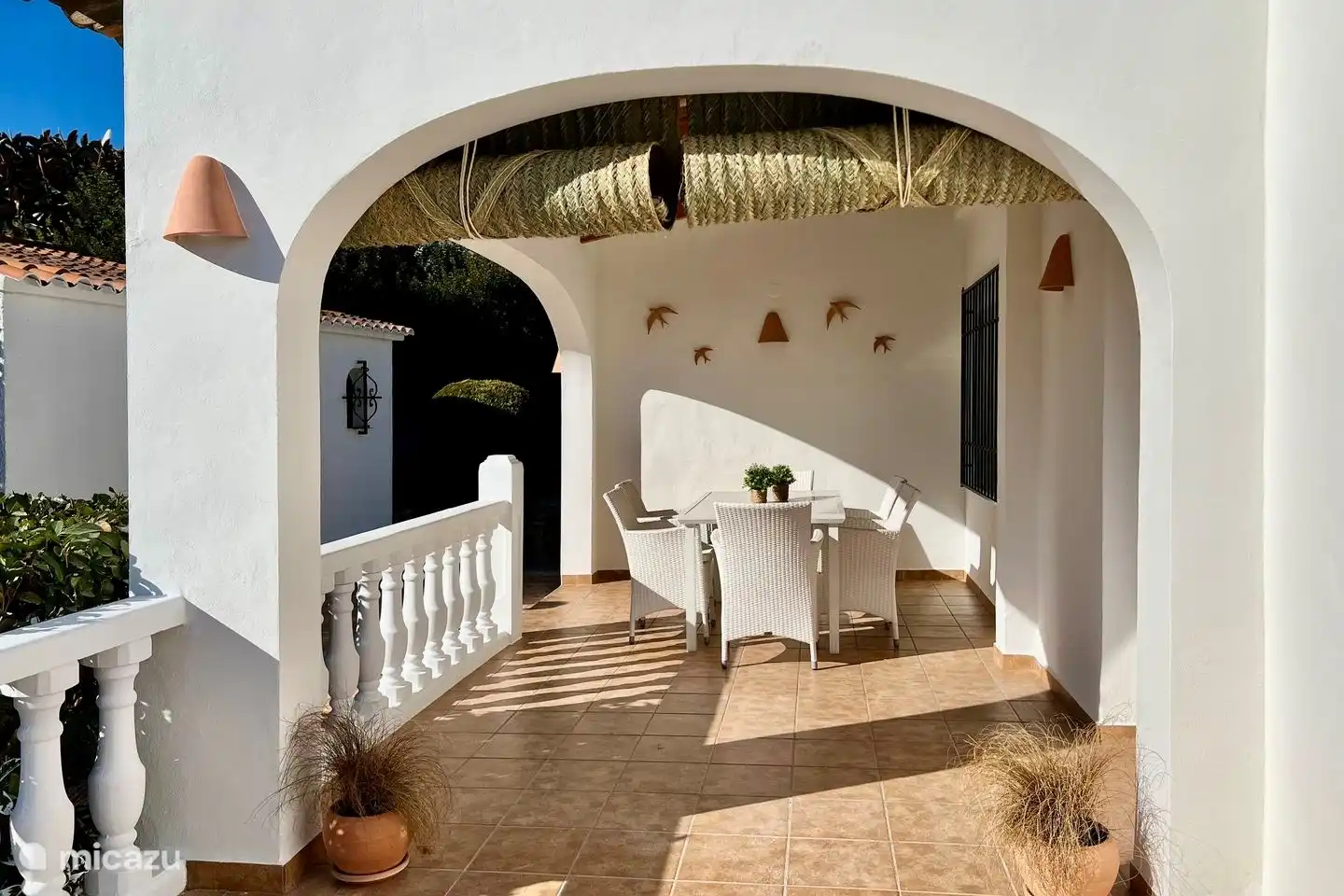 The covered terrace of Villa Lara offers shade when the sun shines