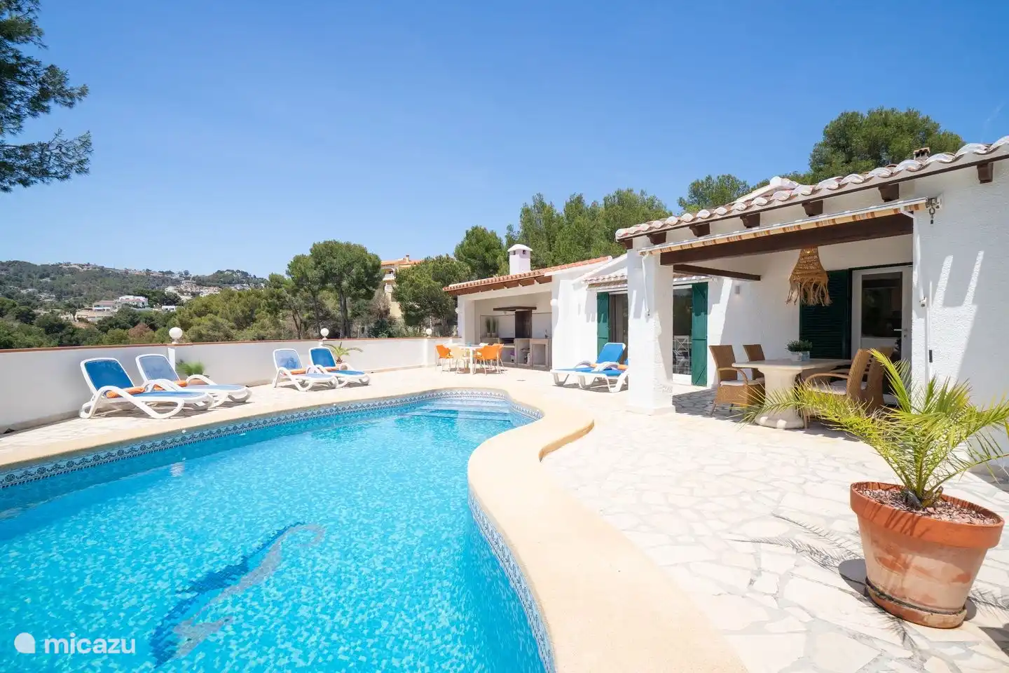 Around the pool of Villa Naranja are several seating areas