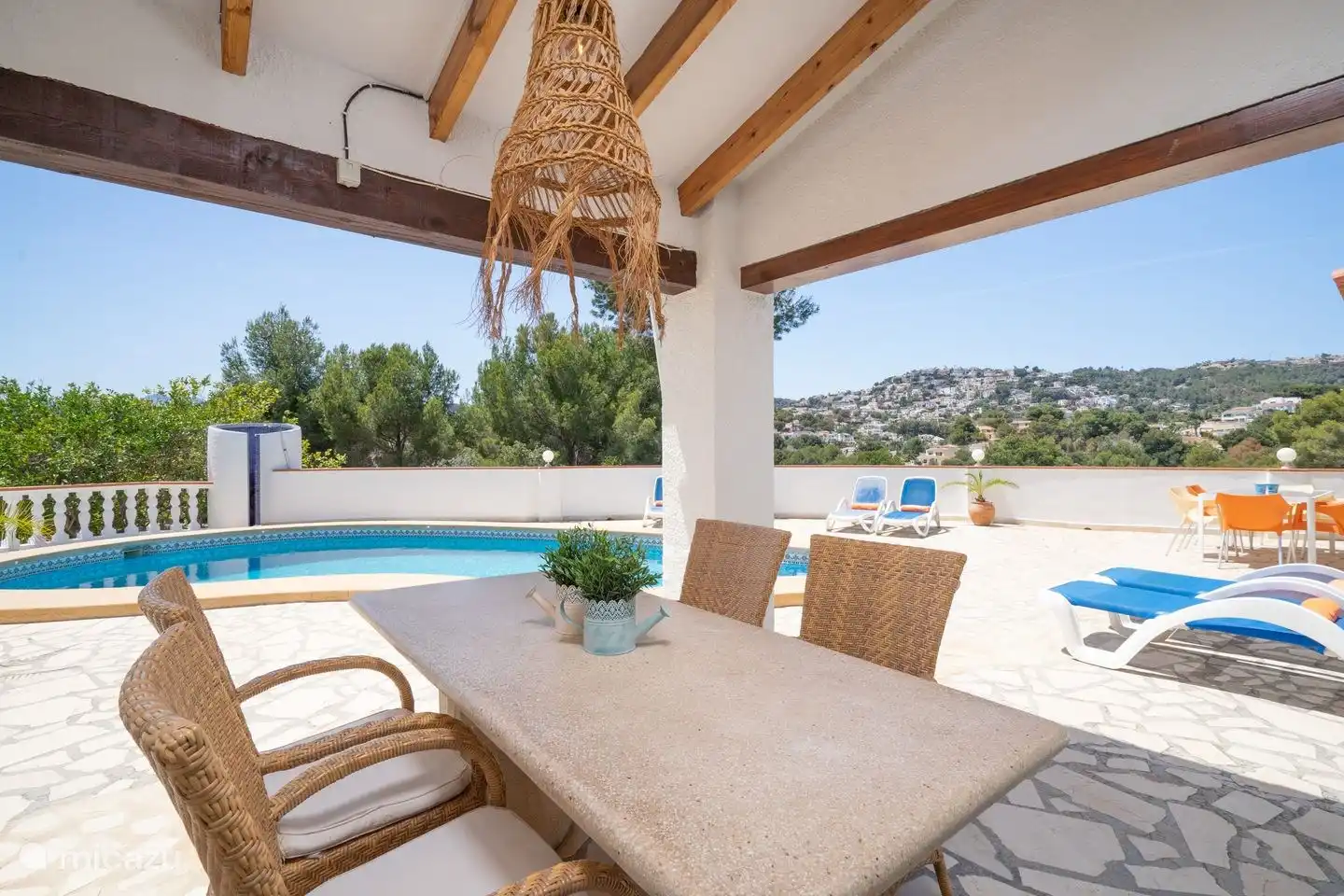 The covered terrace offers an ideal shaded area