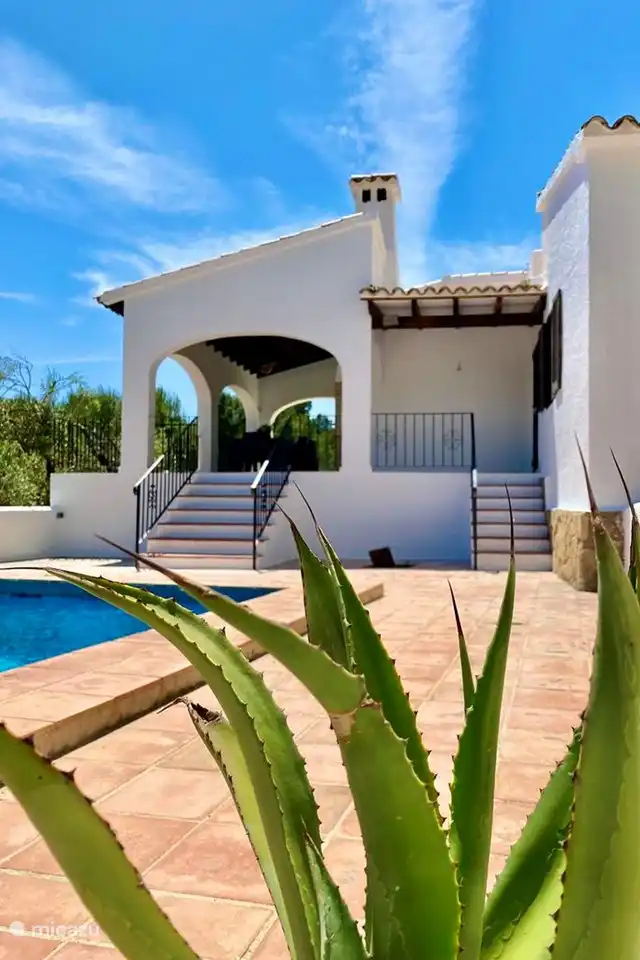 Villa Olivera has a covered terrace and a terrace around the pool