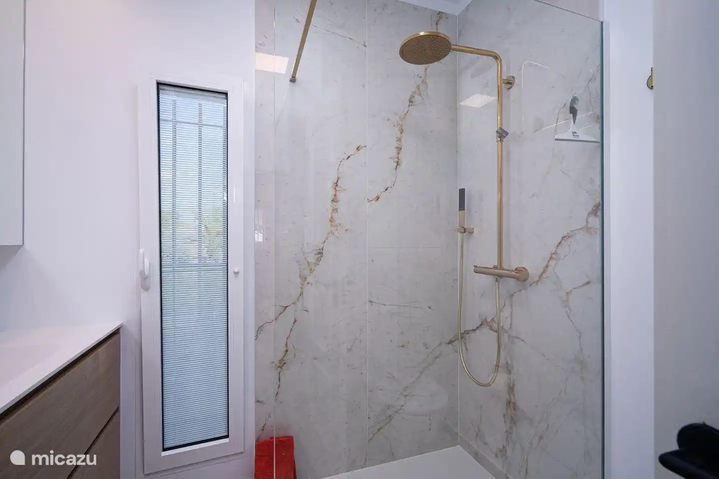 Villa La Serena in Moraira has three modern bathrooms with walk-in rain shower, sink and toilet