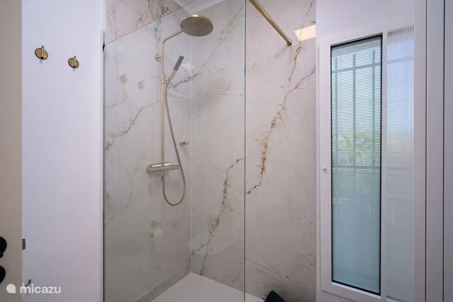 Villa La Serena in Moraira has three modern bathrooms with walk-in rain shower, sink and toilet