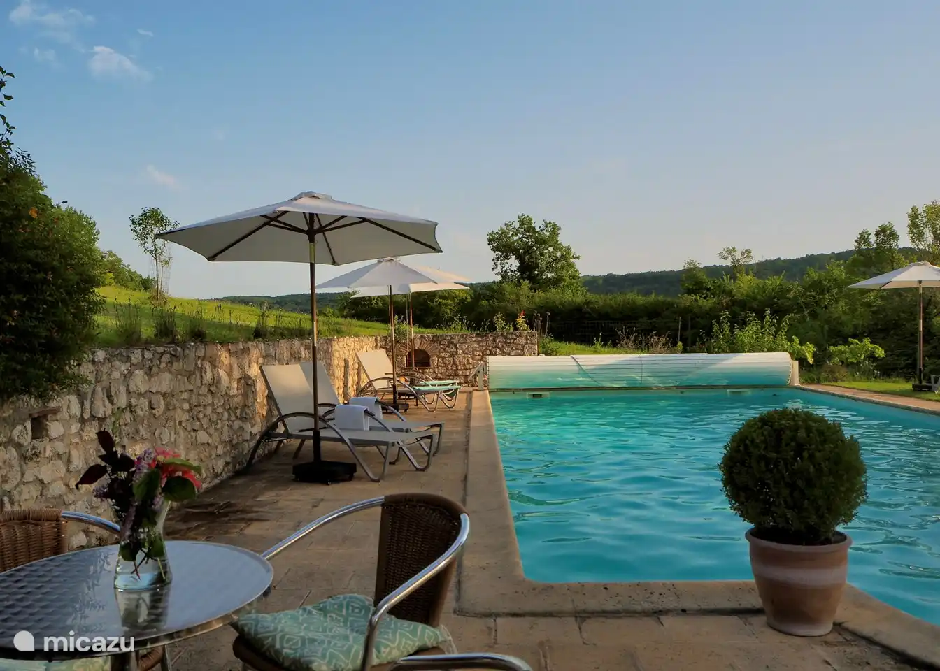 Swimming pool with sun loungers and sitting area